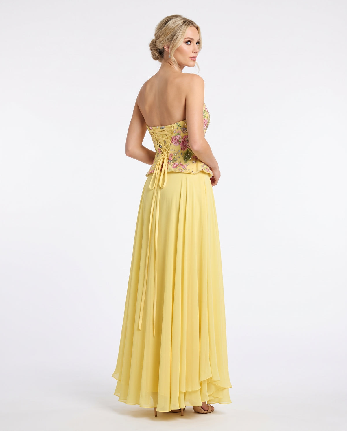 Trägerloses Abendkleid mit floralem Schößchen-Oberteil in Zartrosa Beschreibung: e409